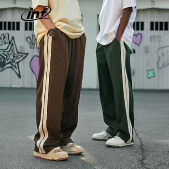 Надуваеми реколта спортни панталони в страничната лента Унисекс с еластична гумена лента за кръста, с широки панталони, мъжки панталони